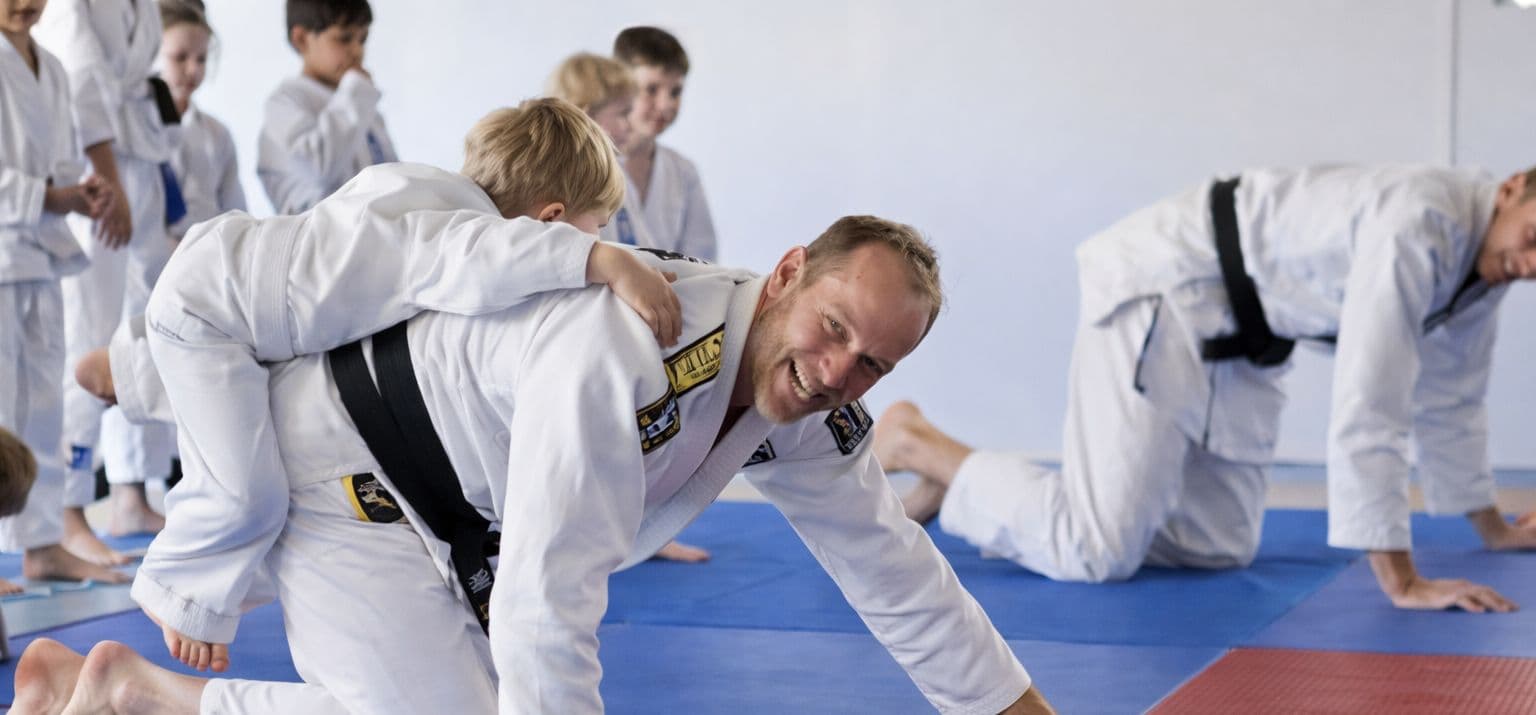 Axis Jiu-Jitsu Academy Logo on Kidsbook